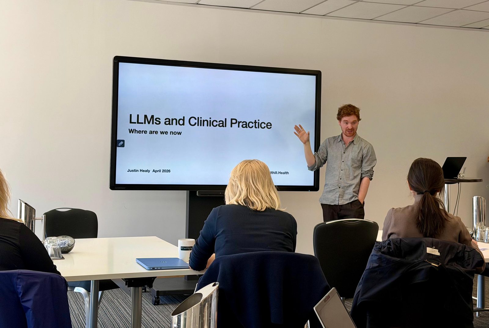 Dr Justin Healy presenting to a workshop group at 1 Wimpole Street